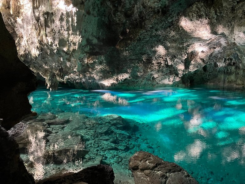 Parque Nacional los Tres Ojos (National Park of the Three Eyes) is a nature reserve and open-air limestone cave system in Santo Domingo, Dominican Republic. Water filters down from the surface and collects in several pools at the base of the sinkhole. In the early morning, the sun is low enough to reach the clear, mineral-rich waters, providing a stunning reward for early risers. Parque Nacional los Tres Ojos (National Park of the Three Eyes) is a nature reserve and open-air limestone cave system in Santo Domingo, Dominican Republic. Water filters down from the surface and collects in several pools at the base of the sinkhole. In the early morning, the sun is low enough to reach the clear, mineral-rich waters, providing a stunning reward for early risers.