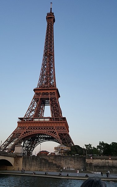 The Eiffel Tower is located in the heart of Paris and is the tallest structure in the city. Locally nicknamed "La dame de fer" (French for "Iron Lady"), it was constructed from 1887 to 1889 as the entrance to the 1889 World's Fair. The wrought-iron lattice tower is named after engineer Gustave Eiffel, whose company designed and built the tower. At 324 m (1,063 ft) tall, it is about the same height as an 81-story building, and measures 125 m (410 ft) on each side. The Eiffel Tower is located in the heart of Paris and is the tallest structure in the city. Locally nicknamed "La dame de fer" (French for "Iron Lady"), it was constructed from 1887 to 1889 as the entrance to the 1889 World's Fair. The wrought-iron lattice tower is named after engineer Gustave Eiffel, whose company designed and built the tower. At 324 m (1,063 ft) tall, it is about the same height as an 81-story building, and measures 125 m (410 ft) on each side.