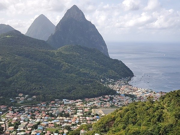 Another view of the Twin Pitons showing more of the town of Soufriere in the foreground Another view of the Twin Pitons showing more of the town of Soufriere in the foreground