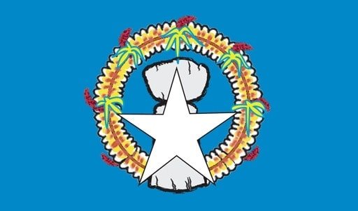 Northern Mariana Islands: blue with a white, five-pointed star superimposed on a gray latte stone (the traditional foundation stone used in building) in the center, surrounded by a mwáár or head lei (wreath); blue symbolizes the Pacific Ocean, the star represents the Commonwealth; the Chamorro latte stone and the Carolinian mwáár (head lei) represent elements of Marianas culture; the mwáár is composed of the flowers from four flowering plants: flores mayo (Plumeria), ylang-ylang or langilang (Cananga odorata), angagha or peacock flower (Caesalpinia pulcherrima), and teibwo or Pacific basil (Ocimum tenuiflorum) Northern Mariana Islands: blue with a white, five-pointed star superimposed on a gray latte stone (the traditional foundation stone used in building) in the center, surrounded by a mwáár or head lei (wreath); blue symbolizes the Pacific Ocean, the star represents the Commonwealth; the Chamorro latte stone and the Carolinian mwáár (head lei) represent elements of Marianas culture; the mwáár is composed of the flowers from four flowering plants: flores mayo (Plumeria), ylang-ylang or langilang (Cananga odorata), angagha or peacock flower (Caesalpinia pulcherrima), and teibwo or Pacific basil (Ocimum tenuiflorum)