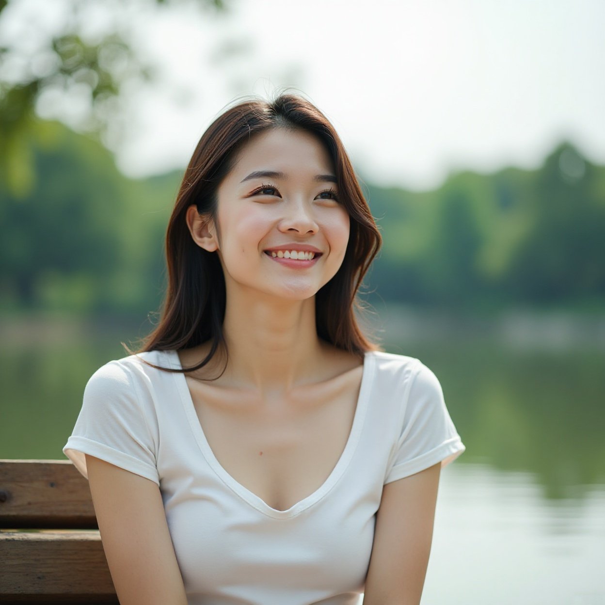 A beautiful, smiling Chinese woman with a lovely figure, wearing a low-cut t-shirt, is sitting and reflecting on a bench in front of the lake. A beautiful, smiling Chinese woman with a lovely figure, wearing a low-cut t-shirt, is sitting and reflecting on a bench in front of the lake.