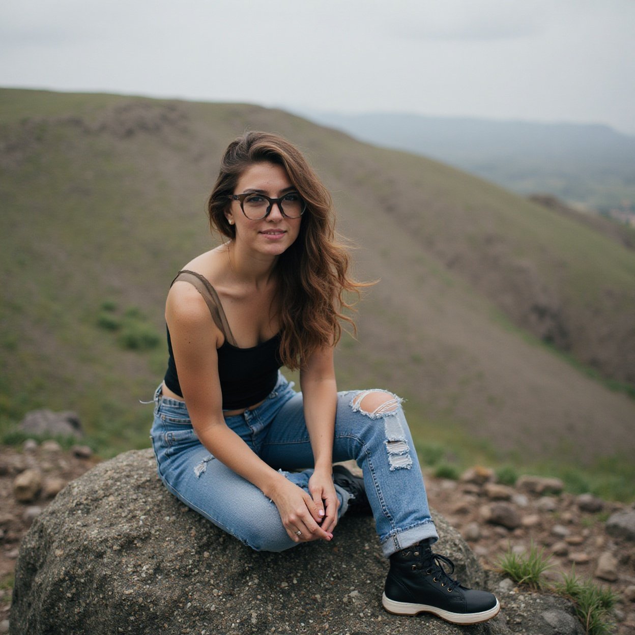 woman who is sitting on a rock woman who is sitting on a rock