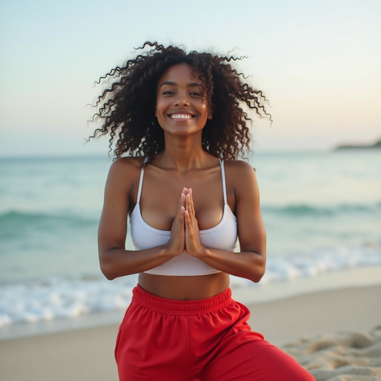 A beautiful, smiling Black woman with a lovely bust, wearing a low-cut tank top and red pants, doing yoga on the beach A beautiful, smiling Black woman with a lovely bust, wearing a low-cut tank top and red pants, doing yoga on the beach